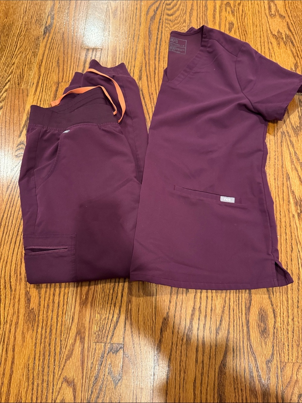 Figs technical Women’s Burgundy Scrub Top & Jogger Set with Orange Drawstring